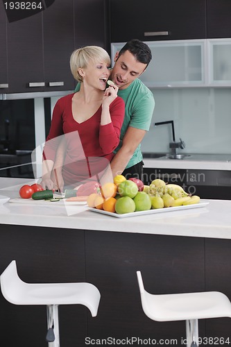 Image of young couple have fun in modern kitchen