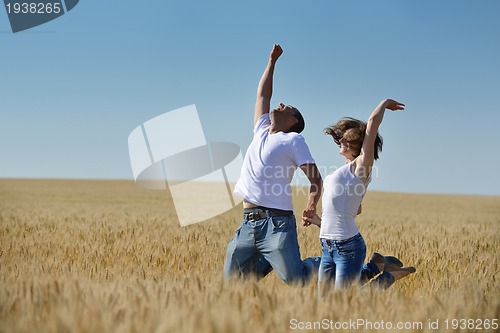 Image of happy couple in wheat field