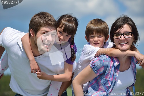 Image of happy young family have fun outdoors