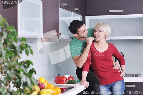 Image of young couple have fun in modern kitchen