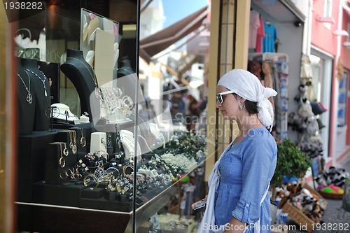 Image of Greek woman on the streets of Oia, Santorini, Greece