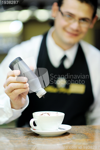 Image of Barista prepares cappuccino