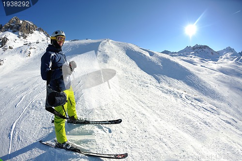 Image of skiing on fresh snow at winter season at beautiful sunny day