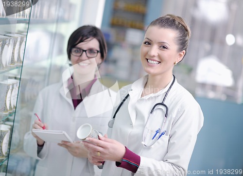 Image of team of pharmacist chemist woman  in pharmacy drugstore