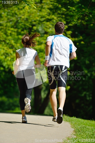 Image of Young couple jogging