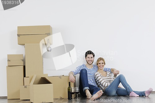 Image of Young couple moving in new home