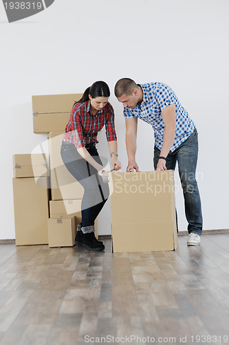 Image of Young couple moving in new house