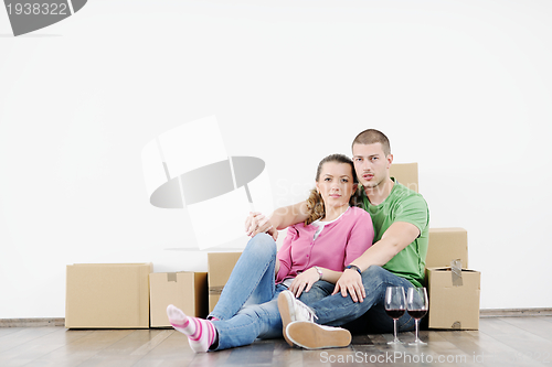 Image of Young couple moving in new house