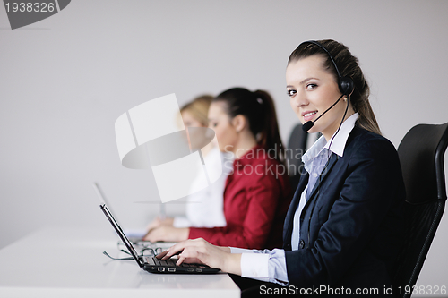 Image of business woman group with headphones