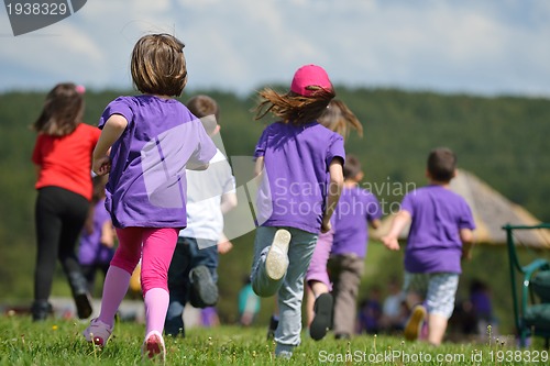 Image of happy kids group  have fun in nature