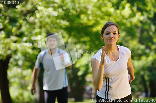 Image of Young couple jogging