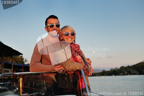 Image of couple in love  have romantic time on boat