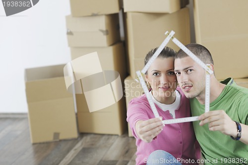 Image of Young couple moving in new home