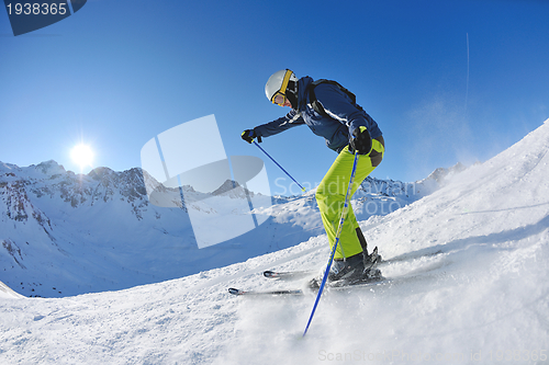 Image of skiing on fresh snow at winter season at beautiful sunny day