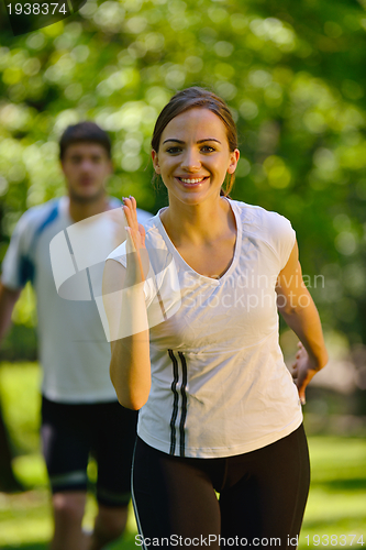 Image of Young couple jogging