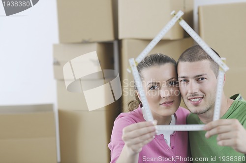 Image of Young couple moving in new home