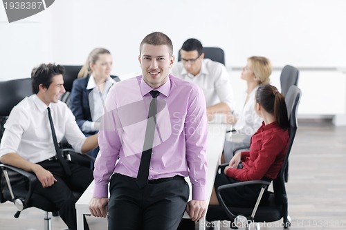 Image of young business man at meeting