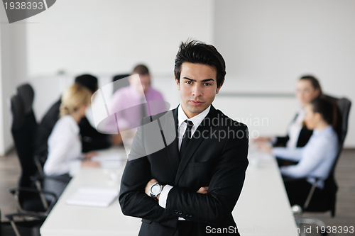 Image of young business man at meeting