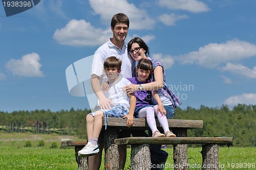 Image of happy young family have fun outdoors