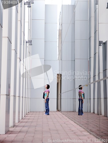 Image of beautiful young woman in the city