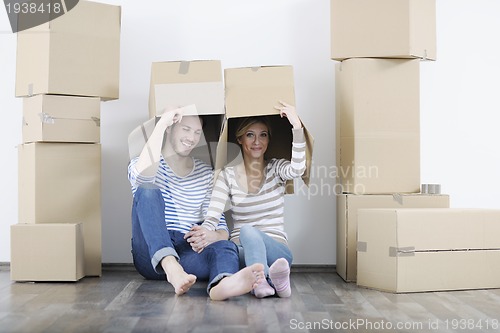 Image of Young couple moving in new home