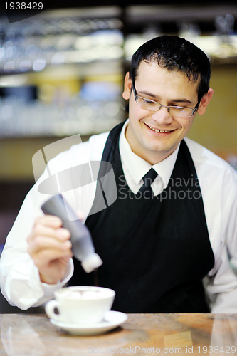 Image of Barista prepares cappuccino