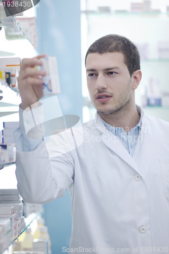 Image of pharmacist chemist man in pharmacy drugstore