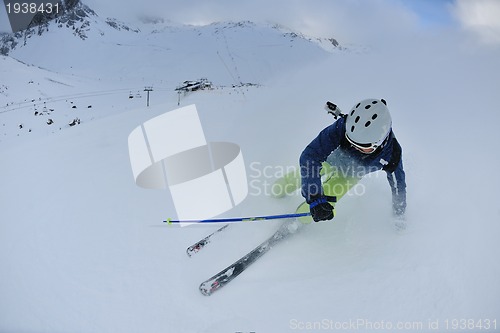 Image of skiing on fresh snow at winter season at beautiful sunny day