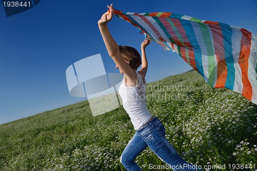 Image of young woman in wheat field at summer