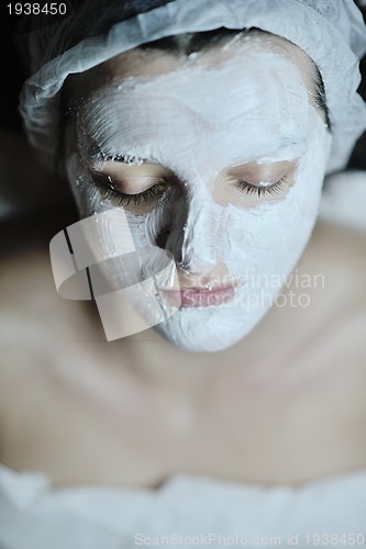 Image of woman with facial mask in cosmetic studio