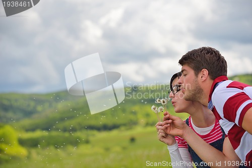 Image of romantic young couple in love together outdoor