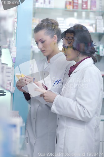 Image of team of pharmacist chemist woman  in pharmacy drugstore