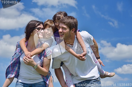 Image of happy young family have fun outdoors