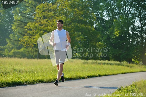 Image of Young couple jogging at morning