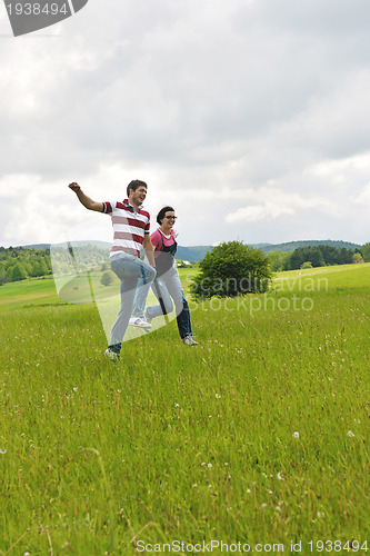 Image of romantic young couple in love together outdoor
