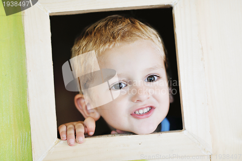 Image of happy child in a window