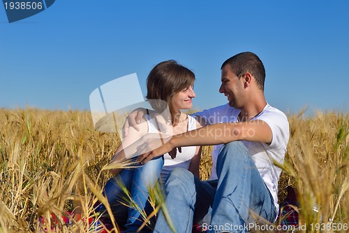 Image of happy couple in wheat field