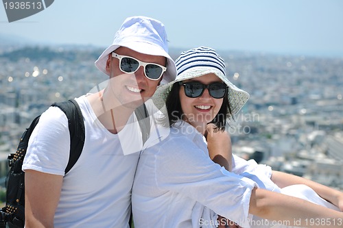 Image of happy young couple tourists in greece