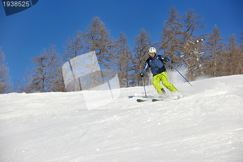 Image of skiing on fresh snow at winter season at beautiful sunny day