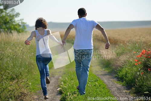 Image of happy couple in wheat field
