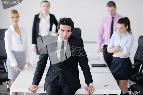 Image of young business man at meeting