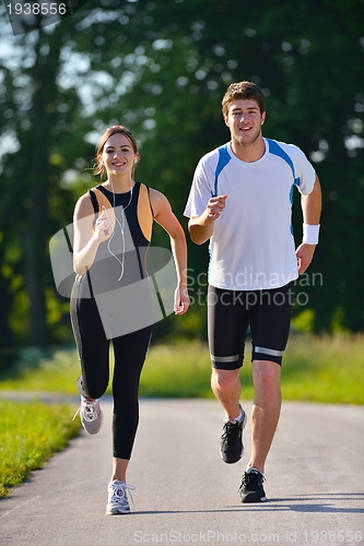 Image of Young couple jogging