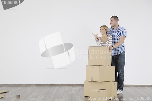 Image of Young couple moving in new home