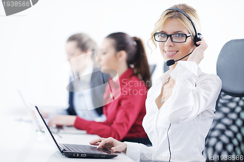 Image of business woman group with headphones