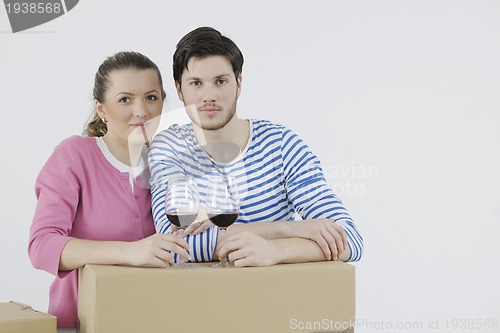 Image of Young couple moving in new home