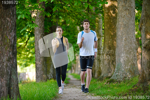 Image of Young couple jogging