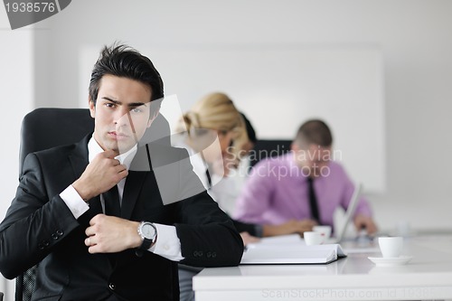 Image of young business man at meeting