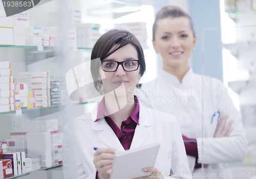 Image of team of pharmacist chemist woman  in pharmacy drugstore