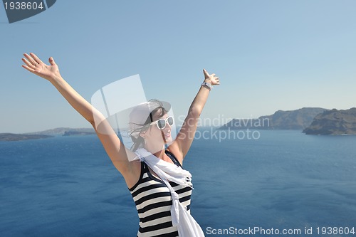 Image of Greek woman on the streets of Oia, Santorini, Greece