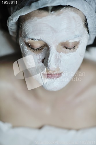 Image of woman with facial mask in cosmetic studio